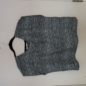 Very cute cropped short sleeve blouse with open lower back. RUMORS